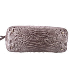 Gray croc-embossed satchel base with metal feet and side hardware, back view