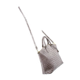 Gray croc-embossed satchel with long shoulder strap and gold-tone hardware, angled