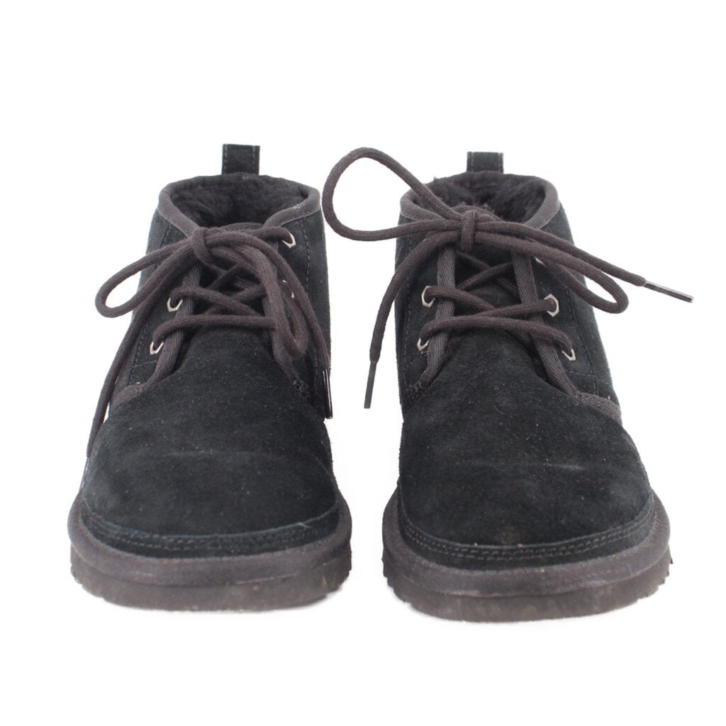 Pair of black suede booties with lace-up eyelets and cushioned collar