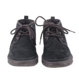 Pair of black suede booties with lace-up eyelets and cushioned collar