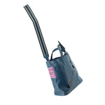 INTOXIC blue textured tote bag with long shoulder strap and side graphic