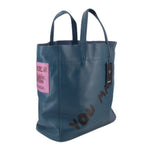INTOXIC blue textured tote bag with side pink tag and graphic lettering