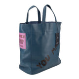 INTOXIC blue textured tote bag with side pink tag and graphic lettering