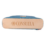 Teal crossbody bag with CONSUELA logo back patch and tan edge trim
