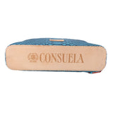 Teal crossbody bag with CONSUELA logo back patch and tan edge trim