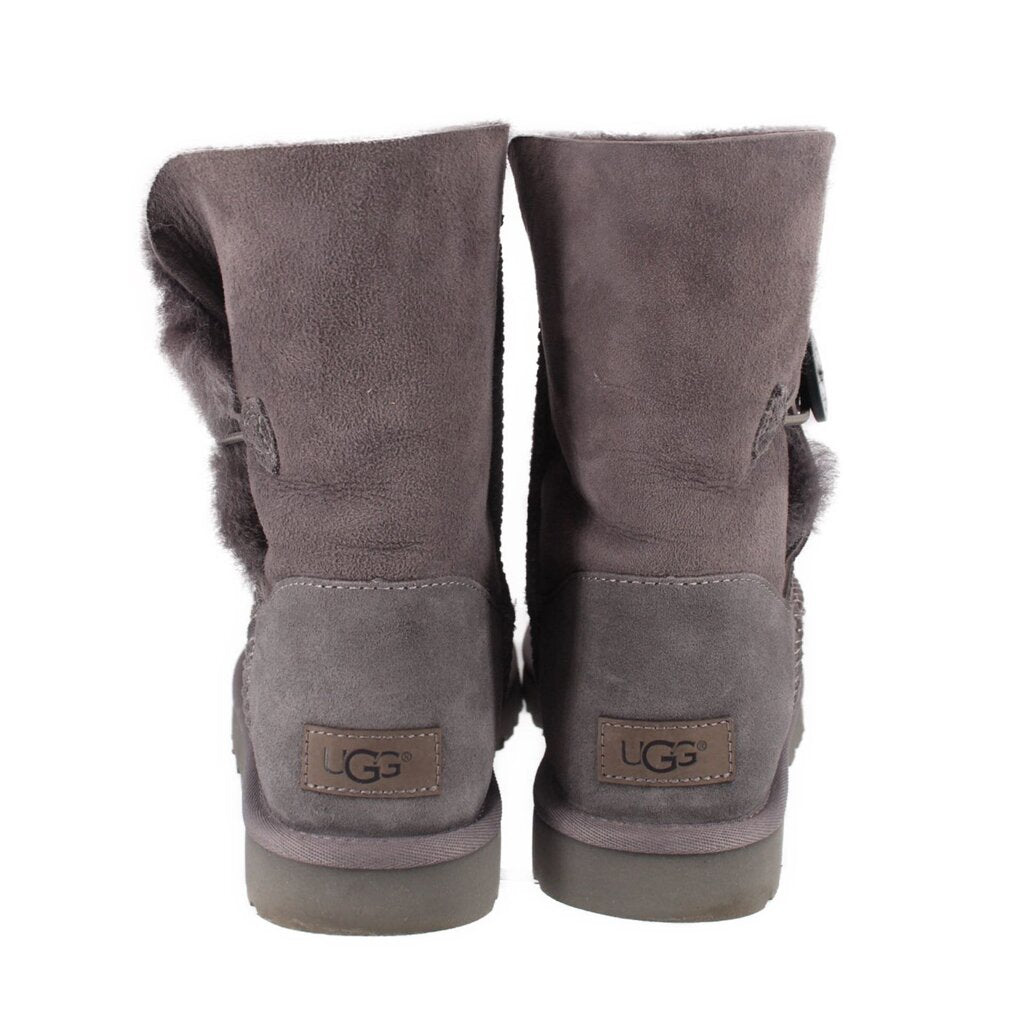 UGG gray suede boots with rear logo patch and fuzzy cuff trim
