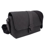 Black leather crossbody messenger bag with flap and side strap loop