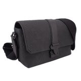 Black leather crossbody messenger bag with flap and side strap loop