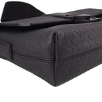 Black leather corner view of messenger crossbody bag with flap edge stitching