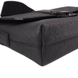 Black leather corner view of messenger crossbody bag with flap edge stitching