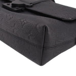 Black leather side view of messenger crossbody bag with flap seam detail