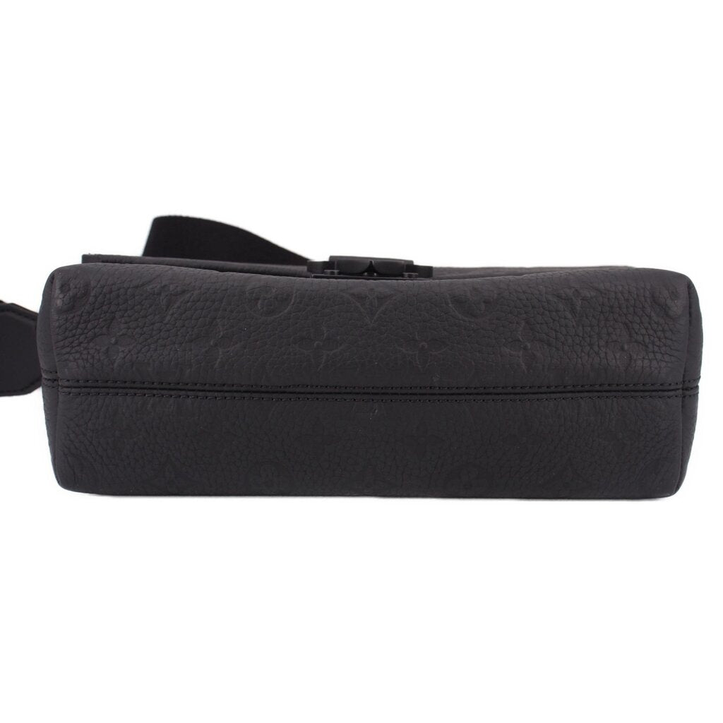 Black leather crossbody messenger bag end view with stitching and strap loops