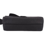 Black leather crossbody messenger bag end view with stitching and strap loops