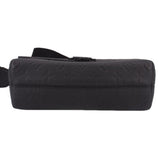 Black leather crossbody messenger bag end view with stitching and strap loops