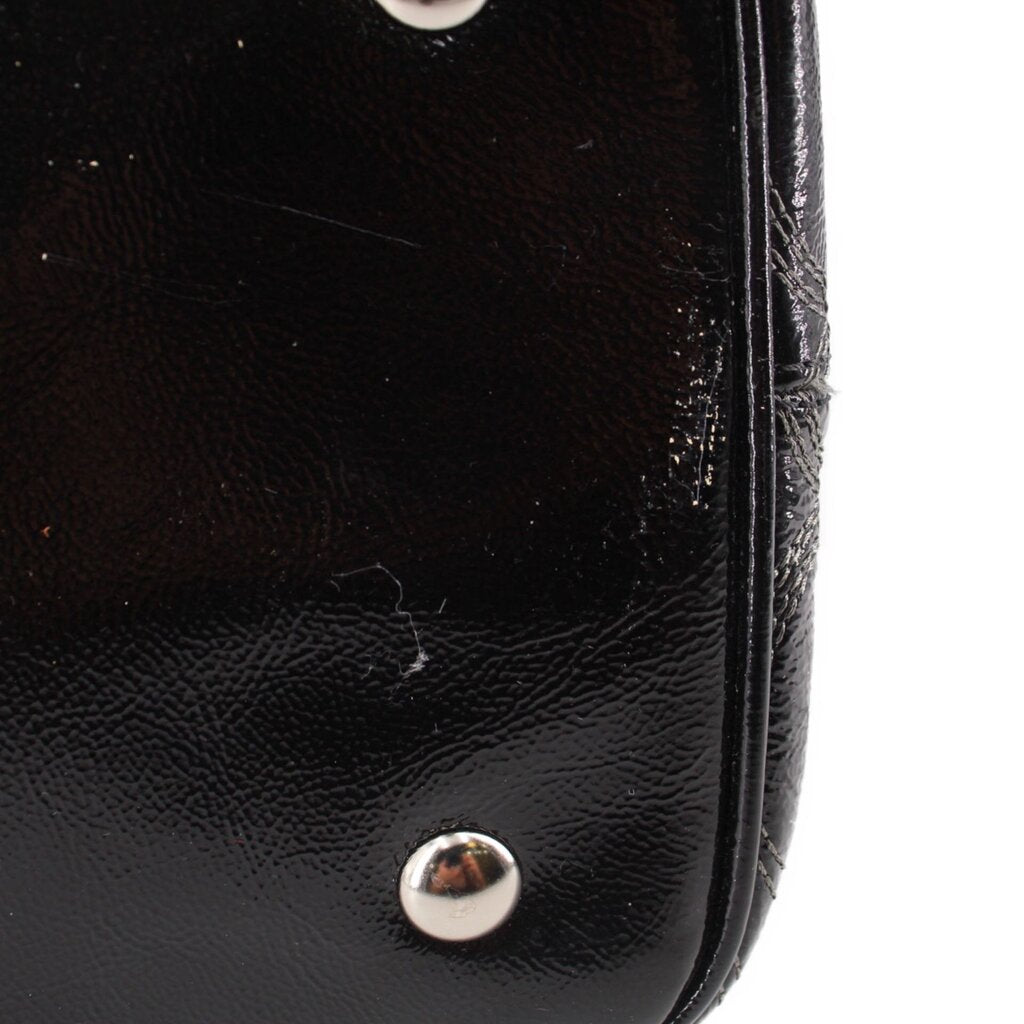 Black leather-look tote panel with snap button and top edge stitching
