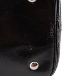Black leather-look tote panel with snap button and top edge stitching