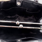 Tote interior with kisslock turn-lock hardware and fabric lining