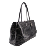 Black kisslock tote bag, angled view, patterned logo design and top handles