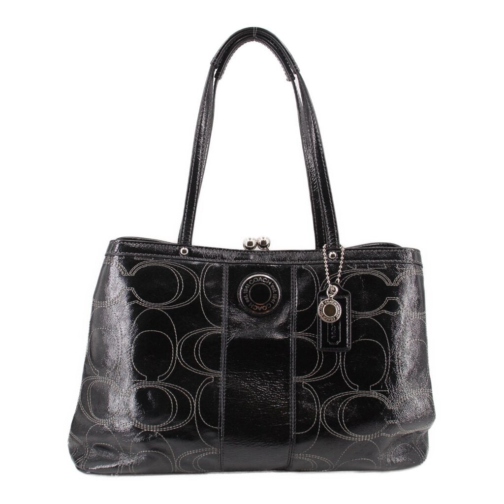 Black kisslock tote bag with patterned fabric and dual top handles