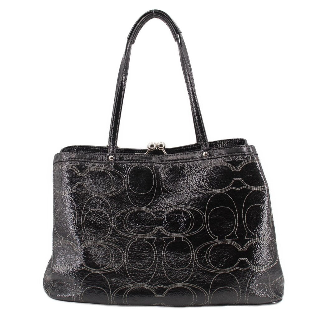 Black patterned kisslock tote bag with round turn-lock clasp and handles