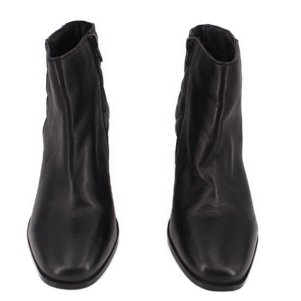 Pair of black ankle boots with side zipper and rounded toe