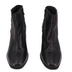 Pair of black ankle boots with side zipper and rounded toe