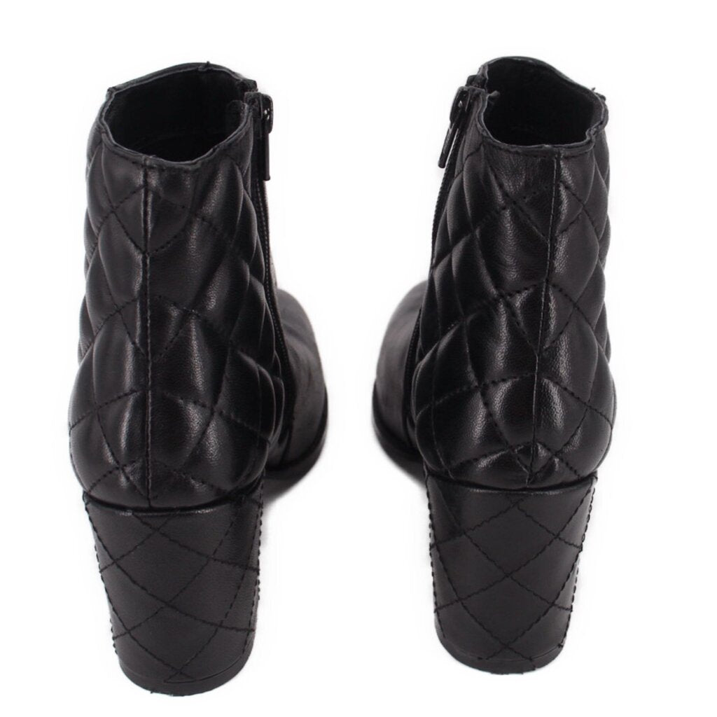 Black ankle boots with quilted diamond stitching on the back and block heel