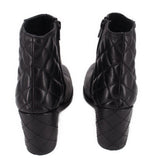 Black ankle boots with quilted diamond stitching on the back and block heel