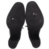 Black ankle boot outsoles with textured tread and block heels