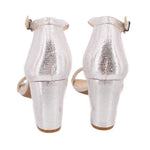 Back view of silver metallic heeled sandals with ankle strap and block heel