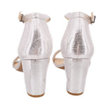 Back view of silver metallic heeled sandals with ankle strap and block heel