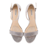 Pair of silver metallic heeled sandals with ankle strap and open-toe design