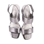 Pewter metallic leather heeled sandals with open toe and ankle straps with buckles