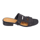 Black slide sandals with wide front strap and cutout buckle design