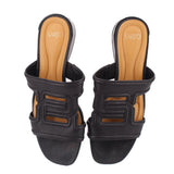 Black slide sandals with two-piece strap and tan cushioned footbed