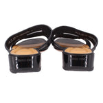 Black slide sandals shown from the heel with cushioned footbeds