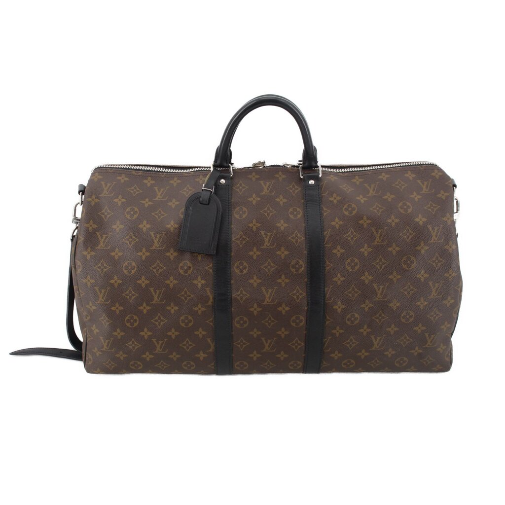 Monogram travel duffel bag with top handles, dark leather trim, and shoulder strap
