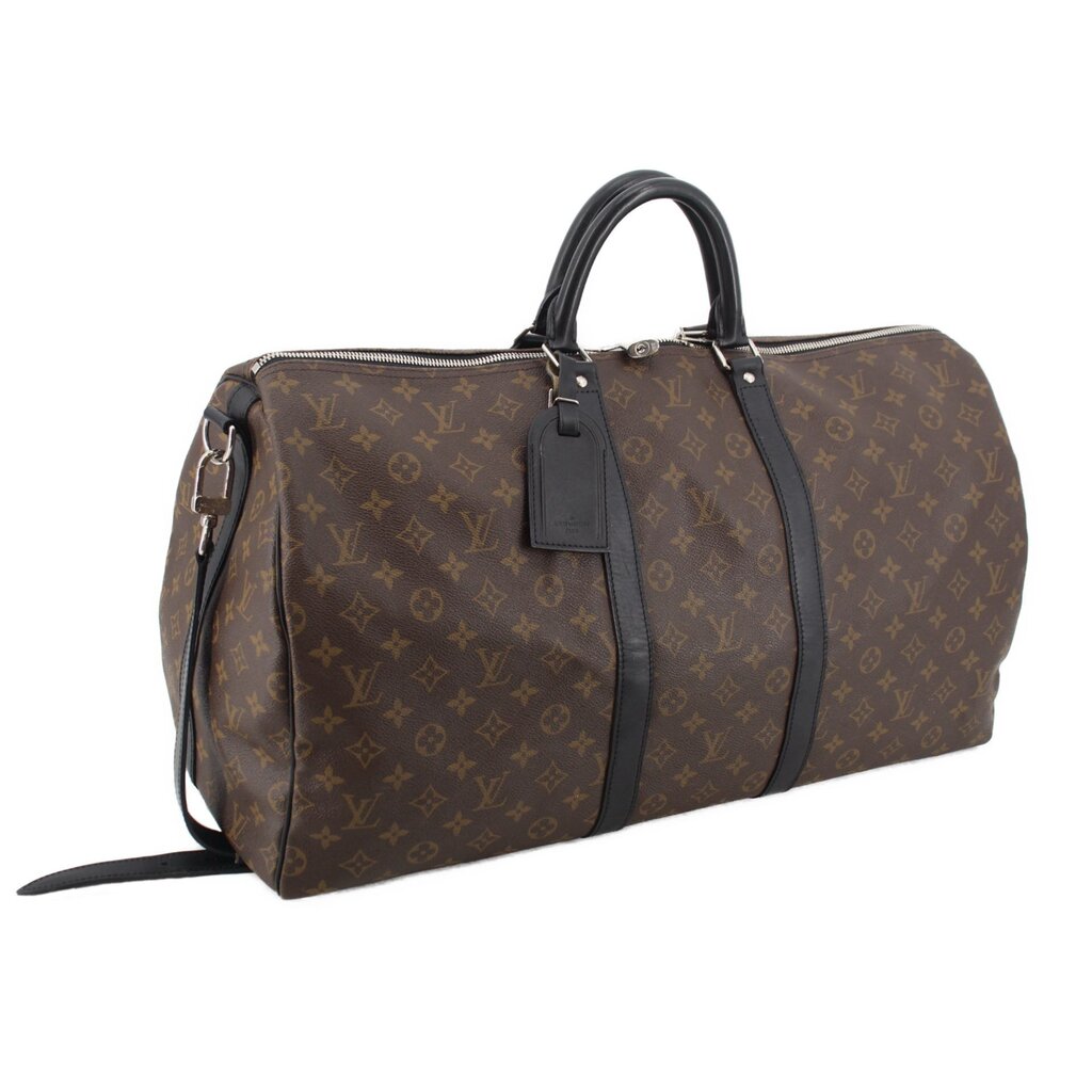 Monogram duffel bag angled view with top handle, dark strap, and end patch panel