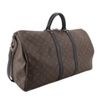 Monogram duffel bag side view with dark leather trim and metal hardware