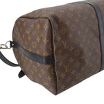 Monogram duffel end with dark leather side band and adjustable strap ring