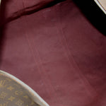 Duffel bag interior lining in dark red with stitched seams