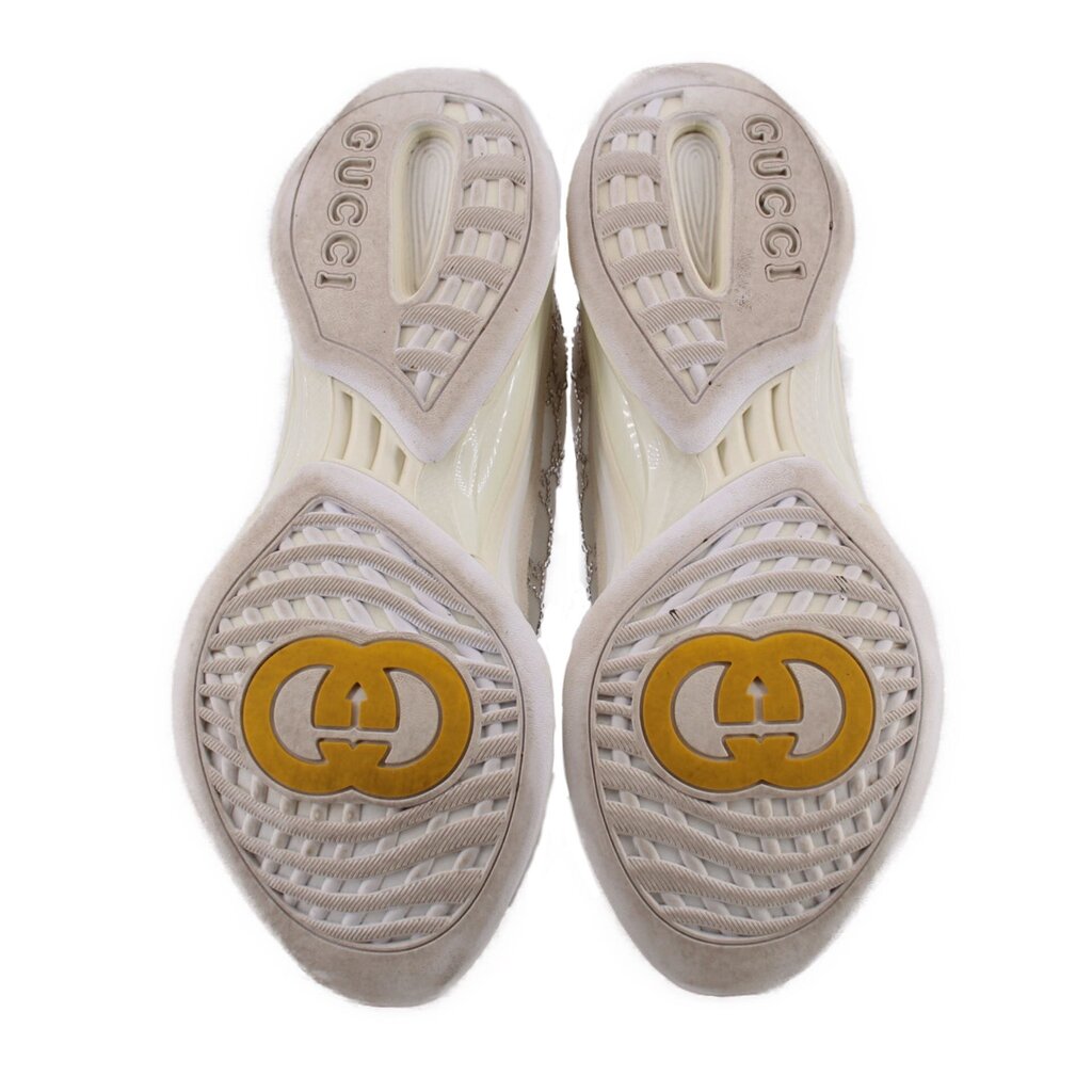 Outsole of crystal sneakers with GG emblem and GUCCI lettering on the heel