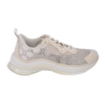 Crystal-studded running sneaker with beige upper, white lace-up, chunky white sole