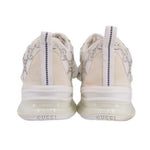 Back view of crystal sneakers with beige heel tabs and white rubber sole