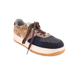 Women’s low-top sneakers in navy, tan, and brown with perforated toe and laces
