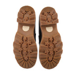 Tan rubber outsole with star-pattern traction