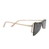 Gold flip-up sunglasses, side view with dark tinted lens and adjustable hinge