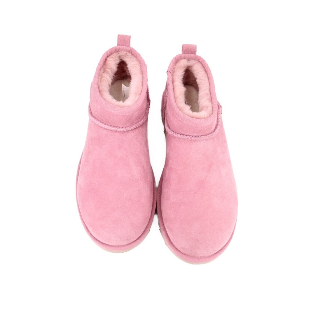 Pink suede ankle booties showing fuzzy lining and open collar