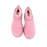 Pink suede ankle booties showing fuzzy lining and open collar
