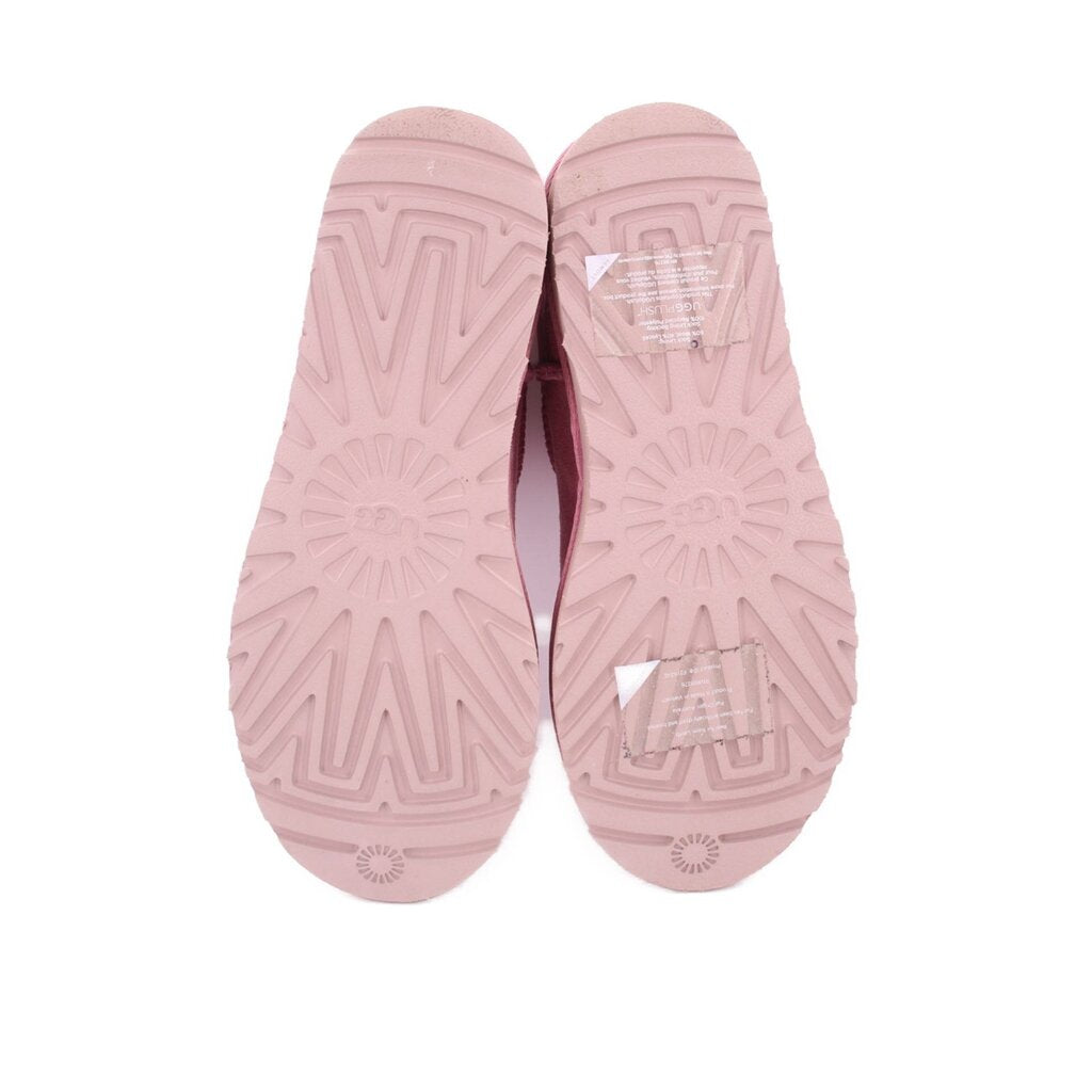 Pink suede ankle booties with patterned rubber outsole tread